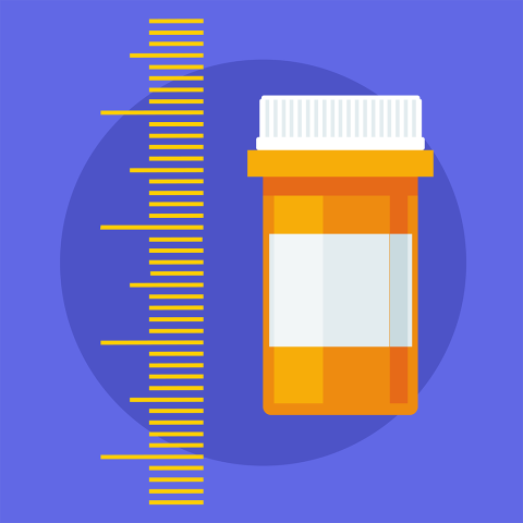 An image of a measuring scale next to a birth control pill bottle